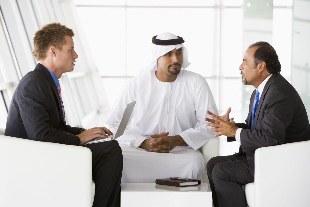 Three people discussing about business
